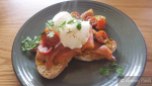 Smoked Salmon on Sourdough with Spicy Avocado Puree, 2 Poached Eggs with Tomato and Herb Salad