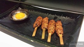 Tsukune – Japanese Grilled Chicken skewers made from tenderloin thigh and softbones with teriyaki sauce and egg yolk on the side to dip